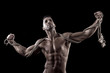 muscled man on a black background