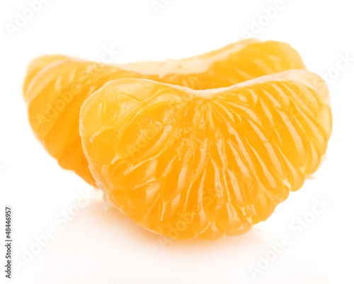 Photo: Ripe sweet tangerine cloves, isolated on white Ripe sweet tangerine cloves, isolated on white