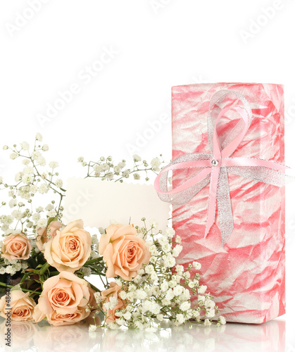 Photo: Giftbox and flowers isolated on white Giftbox and flowers isolated on white
