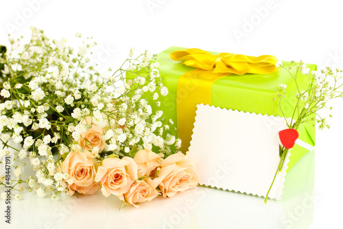 Photo: Giftbox and flowers isolated on white Giftbox and flowers isolated on white