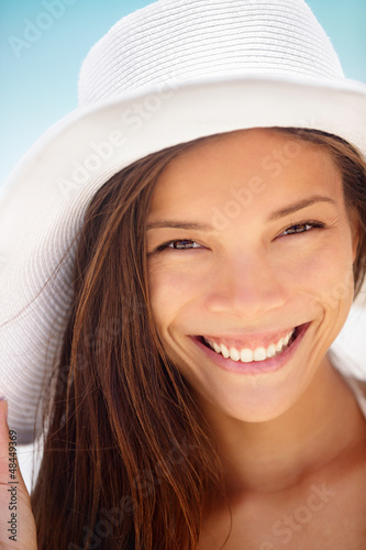 Photo: Beach woman smiling - ethnic girl Beach woman smiling - ethnic girl