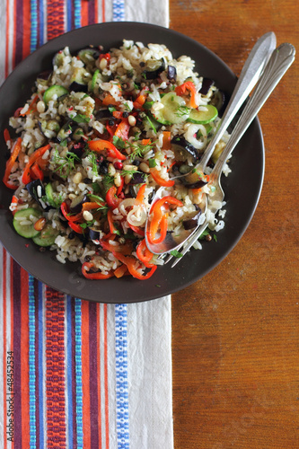 Photo: Portion of brown rice with vegetables on plate Portion of brown rice with vegetables on plate