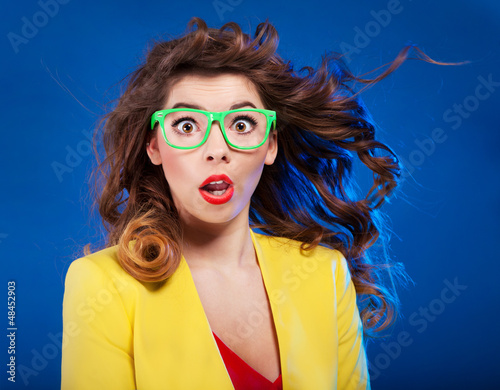 Photo: Colorful portrait of an attractive surprised girl Colorful portrait of an attractive surprised girl