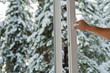 man opens the plastic window with forest view