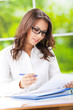 Young smiling businesswoman working at office