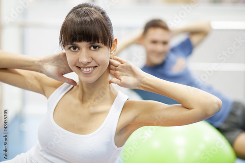 Photo: Young couple in a gym Young couple in a gym