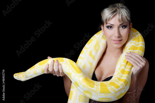 Photo: The beautiful woman with the big yellow snake The beautiful woman with the big yellow snake