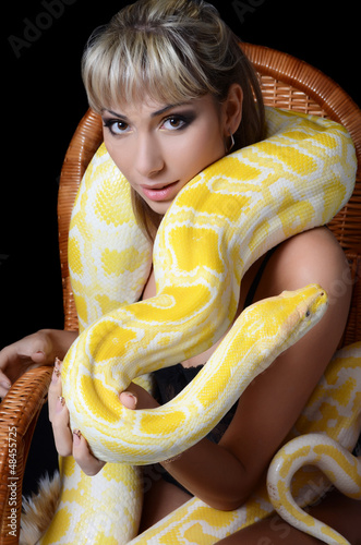Photo: The beautiful woman with the big yellow snake The beautiful woman with the big yellow snake
