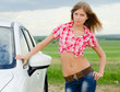 Foto: The beautiful girl stands near to white car The beautiful girl stands near to white car