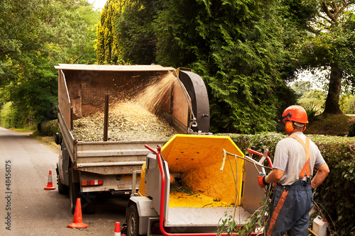 Photo: chipper spewing out chips chipper spewing out chips