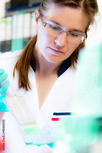 Photo: Scientist works in modern laboratory Scientist works in modern laboratory