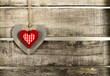 Red heart on old wooden background