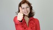 beautiful girl smiling and showing thumbs