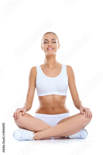Photo: Serene happy woman meditating Serene happy woman meditating