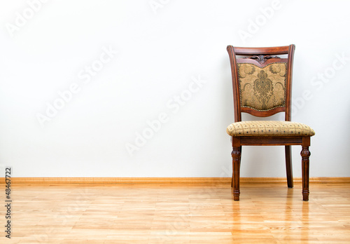 Photo: Interior with classic chair on wooden floor Interior with classic chair on wooden floor