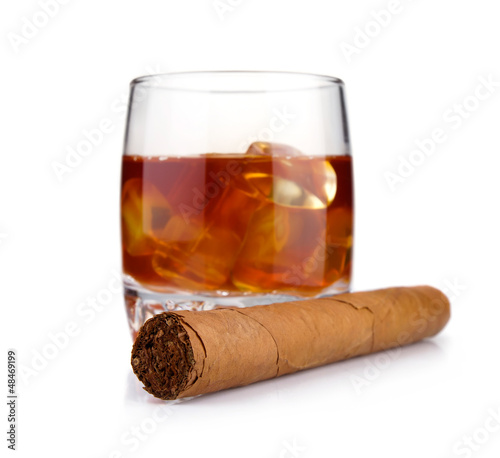 Fototapeta Cigar and glass of whiskey with ice concept isolated