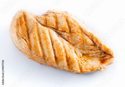 Photo: Grilled chicken breast isolated on white Grilled chicken breast isolated on white