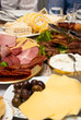 Assorted cold cut meat slices, in a plates