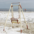Old swing on the beach