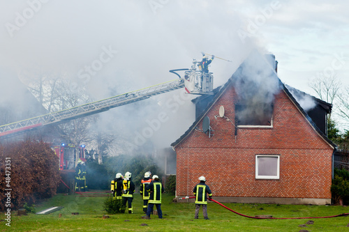 Photo: Firefighters at house fire Firefighters at house fire