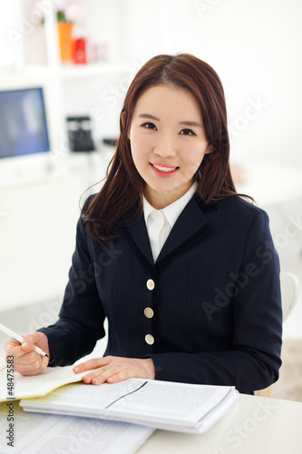 Photo: Yong pretty Asian student studying Yong pretty Asian student studying