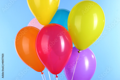 Photo: colorful balloons on blue background colorful balloons on blue background