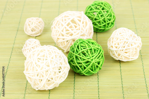 Photo: wicker bamboo balls on bamboo mat wicker bamboo balls on bamboo mat