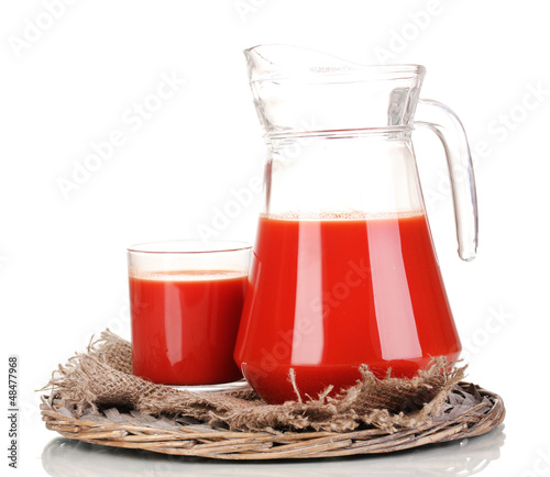 Photo: Tomato juice in pitcher and glass Tomato juice in pitcher and glass