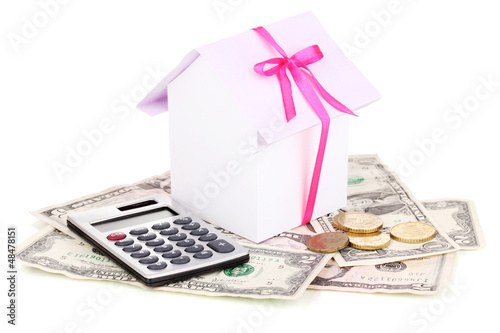 Photo: Small house and money isolated on white Small house and money isolated on white