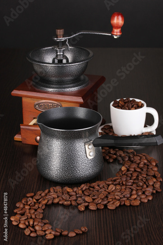 Photo: Coffee maker and coffee mill on brown table Coffee maker and coffee mill on brown table