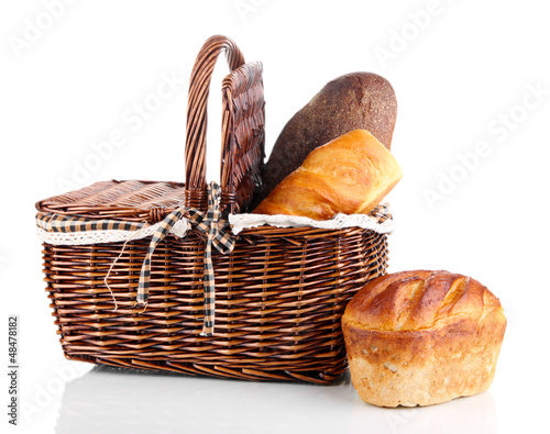 Photo: Fresh bread in basket isolated on white Fresh bread in basket isolated on white
