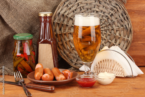 Photo: Beer and grilled sausages Beer and grilled sausages