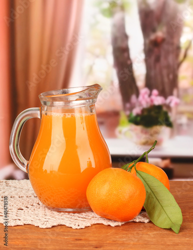 Photo: Full jug of tangerine juice, Full jug of tangerine juice,