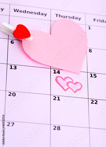 Photo: Notes on the calendar (valentines day), close-up Notes on the calendar (valentines day), close-up