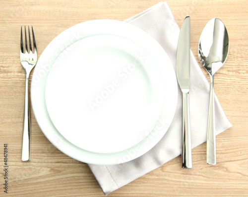 Photo: Table setting on wooden table Table setting on wooden table