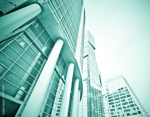Photo: perspective wide angle view to steel blue glass building perspective wide angle view to steel blue glass building