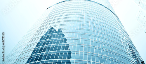 Photo: glass high rise building skyscrapers in modern futuristic glass high rise building skyscrapers in modern futuristic