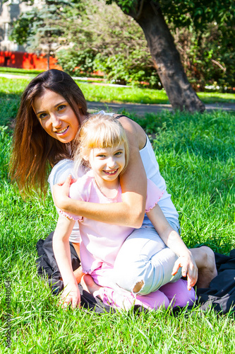 Photo: young mother with a beautiful daughter young mother with a beautiful daughter