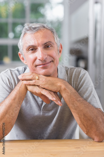 Photo: Portrait of serene man looking at camera Portrait of serene man looking at camera