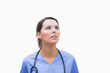 Female surgeon looking up thoughtfully