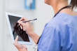 Female doctor using digital tablet