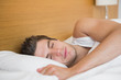 Man asleep in hotel room