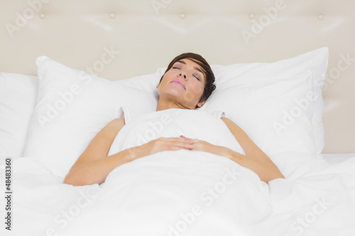 Photo: Beautiful woman sleeping in bed Beautiful woman sleeping in bed
