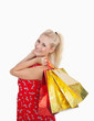 Photo: Portrait of cute young woman with shopping bags Portrait of cute young woman with shopping bags