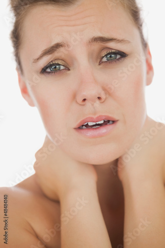 Photo: Woman suffering from neckache Woman suffering from neckache