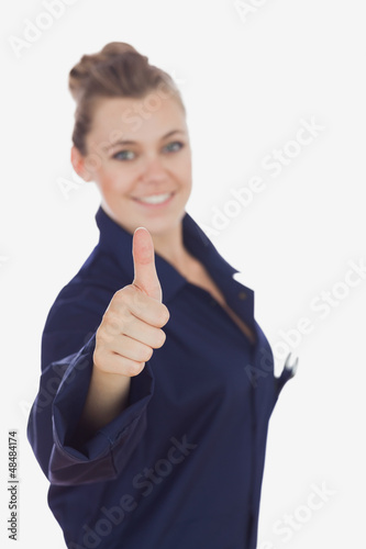 Photo: Female technician gesturing thumbs up Female technician gesturing thumbs up