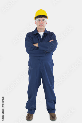 Photo: Confident technician wearing hardhat and eyewear Confident technician wearing hardhat and eyewear
