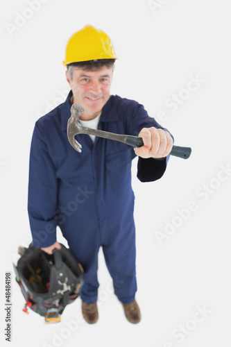 Photo: Mechanic with hammer carrying tool bag Mechanic with hammer carrying tool bag