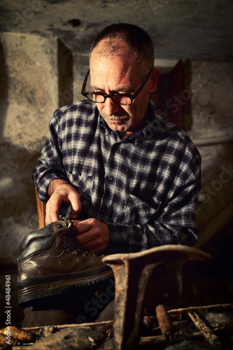 Photo: cobbler at work cobbler at work