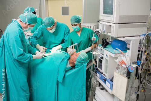 Photo: View of a medical team operating View of a medical team operating